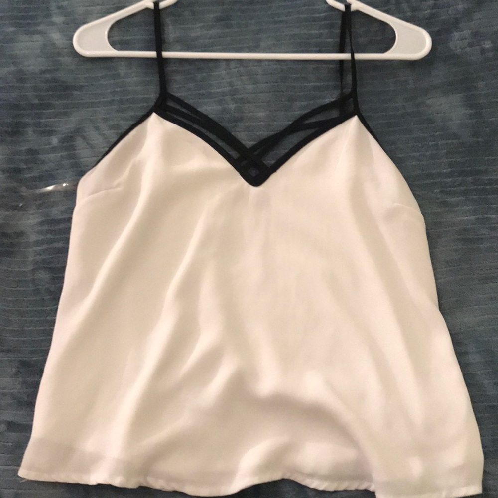 White blouse with v-neck black cross detailing